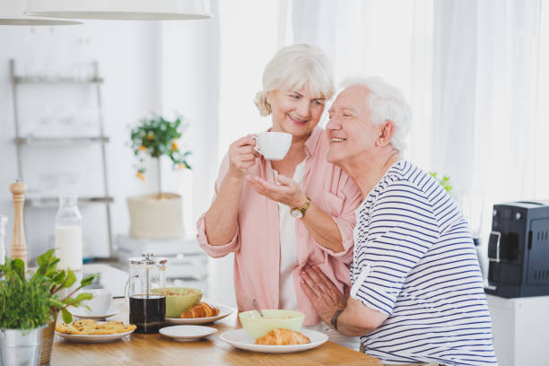 istock Elder man and his wife with a cup 820869568