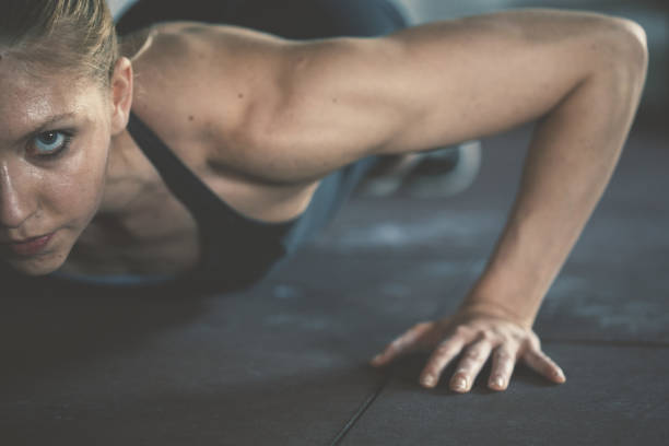 istock gym woman exercising in gym 820872910