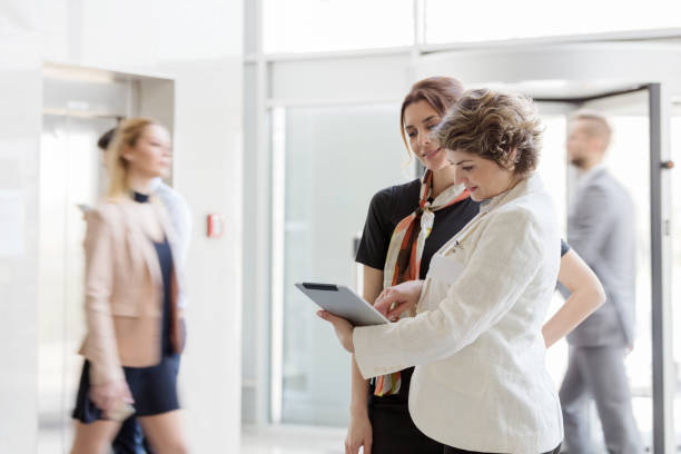 istock Businesswomen using digital tablet in office 820873078
