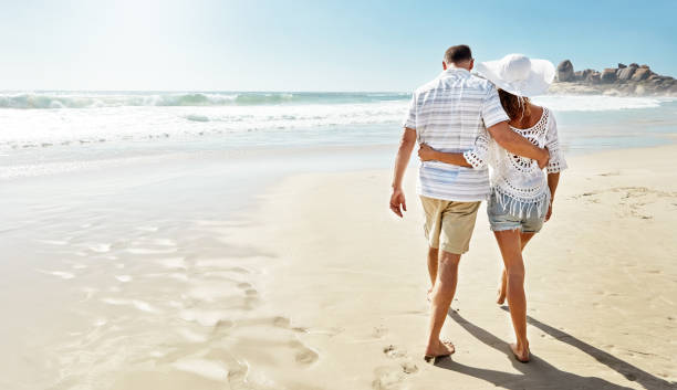 istock Strolls along the beach are their thing 820873900