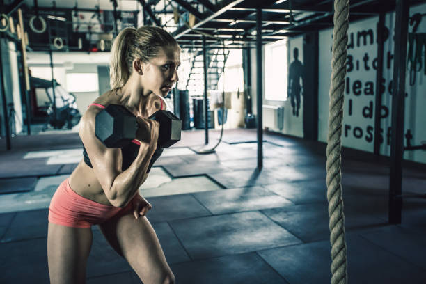 istock Young crossfitter with small weight 820874692