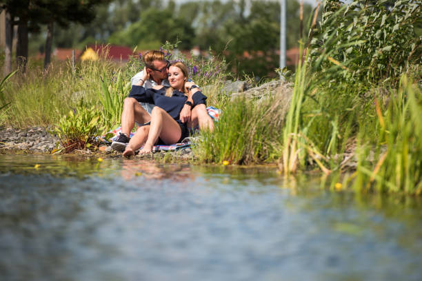 istock Happy couple at lake, Germany 820875434