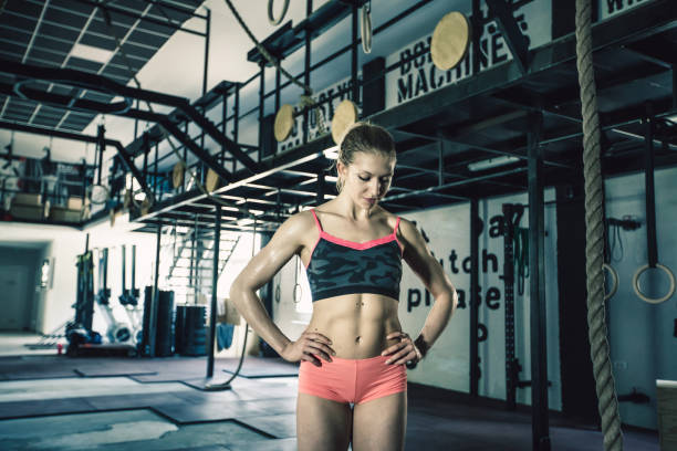 istock Woman exercising in gym 820878860