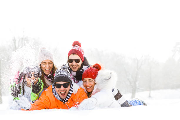 istock Friends enjoying in snow 820882622
