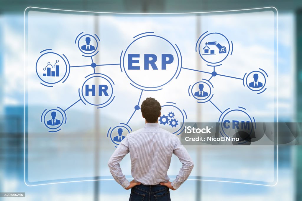 Manager analyzing ERP on AR screen, connections, BI, HR, CRM IT manager analyzing the architecture of ERP (Enterprise Resource Planning) system on virtual AR screen with connections between business intelligence (BI), production, HR and CRM modules Enterprise Resource Planning Stock Photo