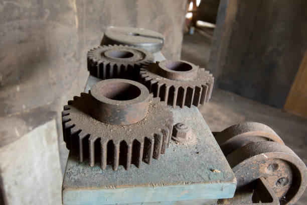 istock Cogs on dirty machinery in factory 820888398