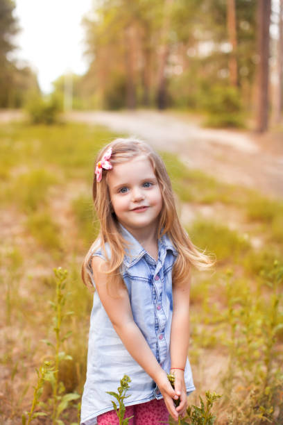 istock Happy girl in a summer park 820889426