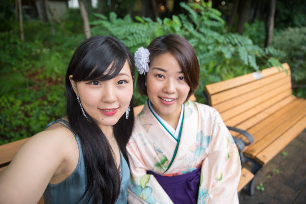 Female graduates talking selfie picture in university