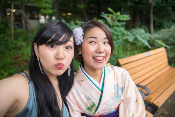 istock Happy female graduates making funny faces in university 820893606