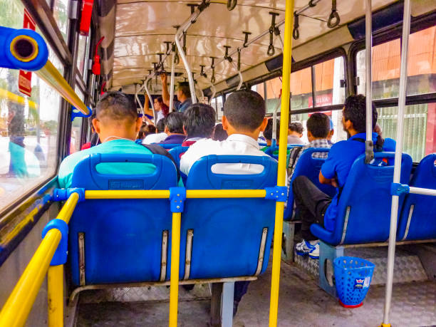 GUAYAQUIL, ECUADOR, NOVEMBER - 2016 - People sitting at interior public bus in Guayaquil, Ecuador