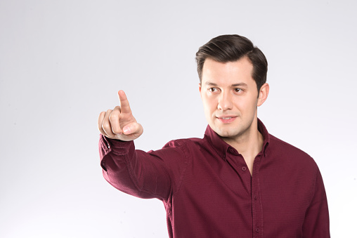 A man touching to air on white background