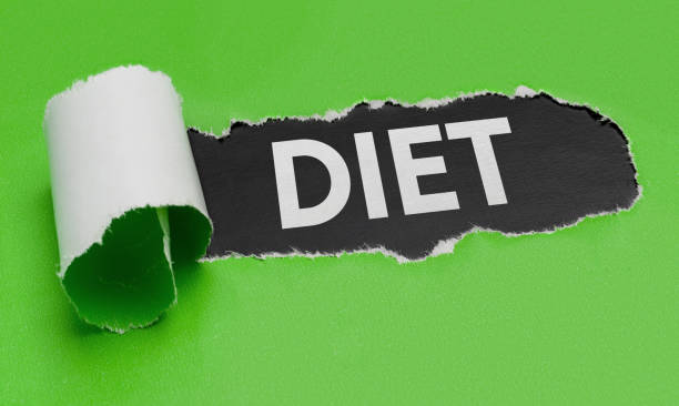istock Torn green paper revealing the word Diet 820908982