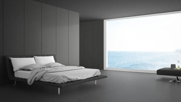 istock Minimalist bedroom with big window on sea panorama, white and gray interior design 820914812