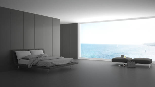 istock Minimalist bedroom with big window on sea panorama, white and gray interior design 820914938