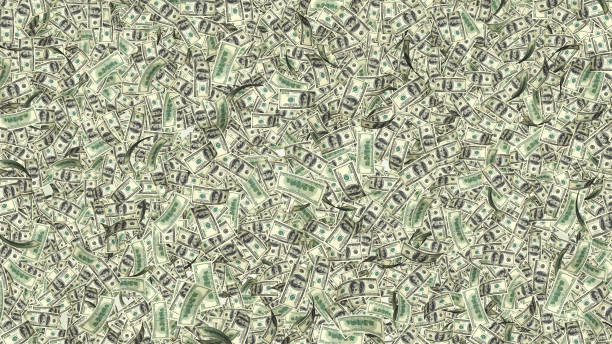 istock Rain from many falling dollars isolated on white background, finance concept 820919332