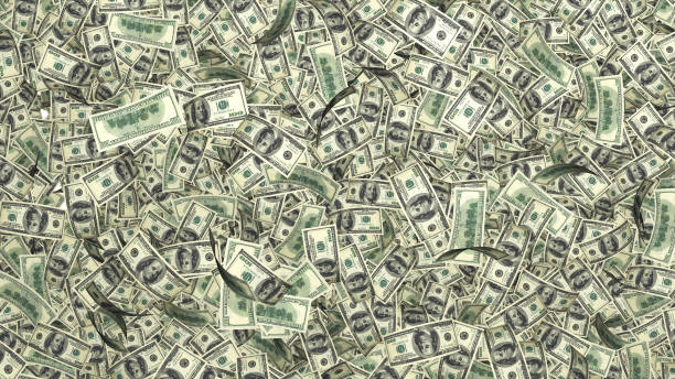 istock Rain from many falling dollars isolated on white background, finance concept 820919380