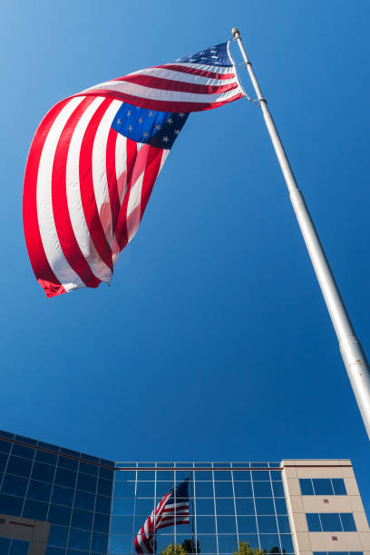 istock America flag and reflection in glass highrise 820929706