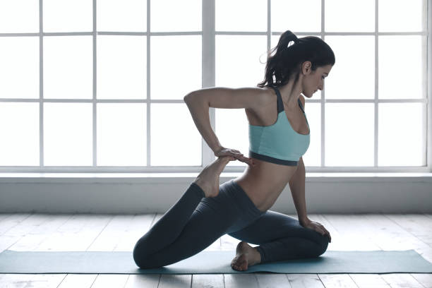 istock Young Woman Doing Yoga Pose Exercise Healthy Lifestyle 820929718