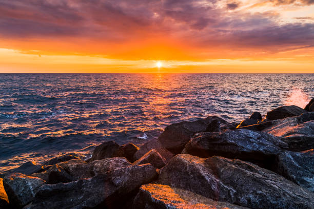 istock Colorful sunset in the evening over the ocean 820933178