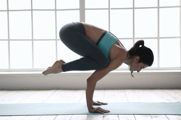 istock Young Woman Doing Yoga Pose Exercise Healthy Lifestyle 820933608