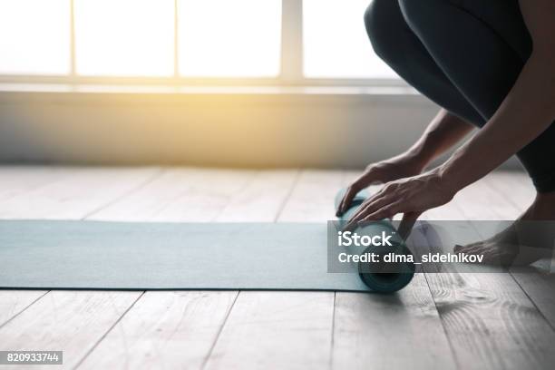 Young Woman Doing Yoga Twist Mat Healthy Lifestyle Stock Photo - Download Image Now - Yoga, Exercise Mat, Exercising