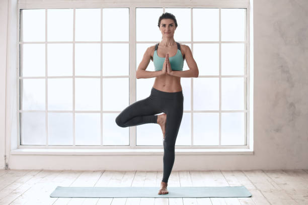 istock Young Woman Doing Yoga Pose Exercise Healthy Lifestyle 820938344