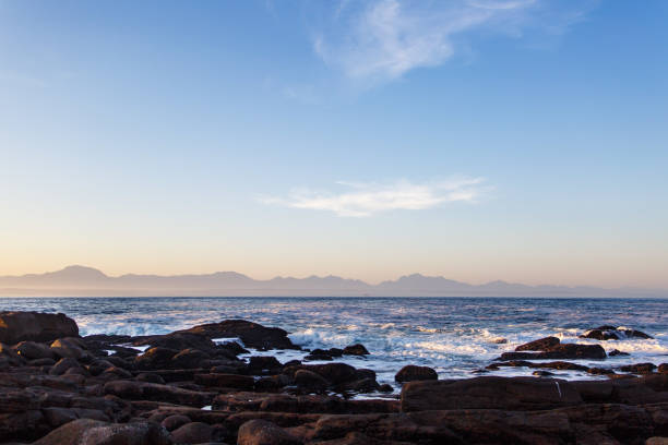 The Point Beach A view of the Indian Ocean with the Outeniqua mountain range. george south africa stock pictures, royalty-free photos & images