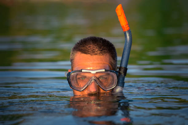 Scuba Diver enjoying snorkeling in the sea.