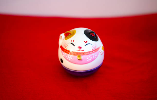 istock Maneki-neko - The maneki-neko is a common Japanese figurine which is often believed to bring good luck to the owner. 820949904