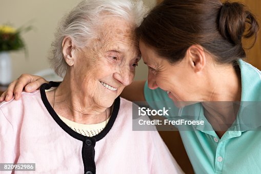istock Dementia and Occupational Therapy - Home caregiver and senior adult woman 820952986