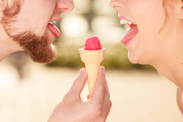 istock young couple eating ice cream outdoor 820955710