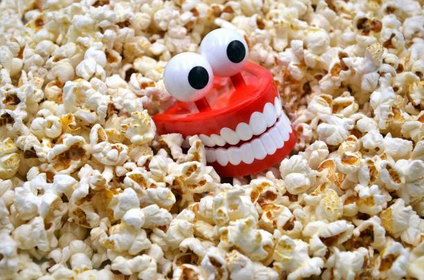 teeth with popcorns stock photo