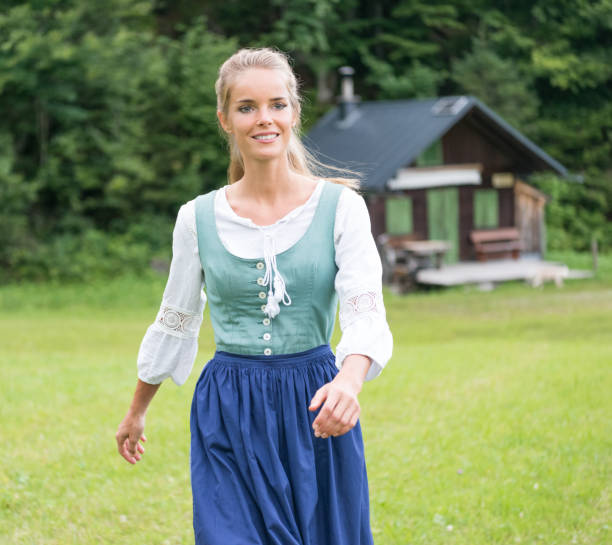 beautiful woman in dirndl costume, austria - dirndl traditional clothing austria traditional culture imagens e fotografias de stock