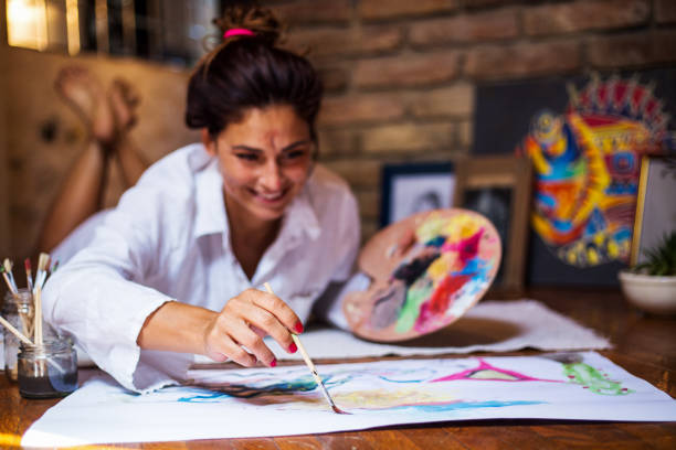istock Beautiful artist enjoying her work 820956382