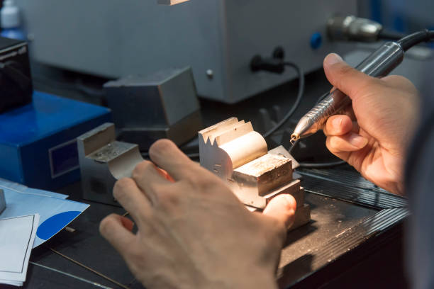 istock The specialist operator use the laser welding machine.he hi-precision welding process . 820960040
