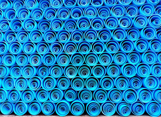 PVC water pipes stacked in container PVC water pipes stacked in container,Blue PVC pipe, PVC pipe for water. pvc conduit stock pictures, royalty-free photos & images