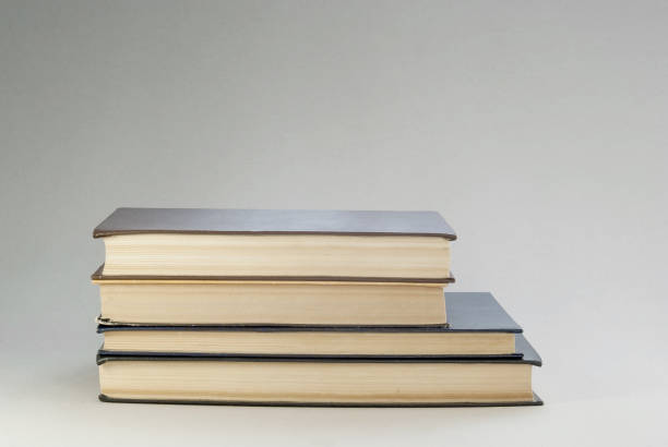 istock Old books with redened pages are stacked 820960444