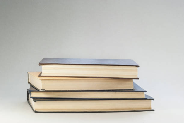 istock Old books with redened pages are stacked 820960524