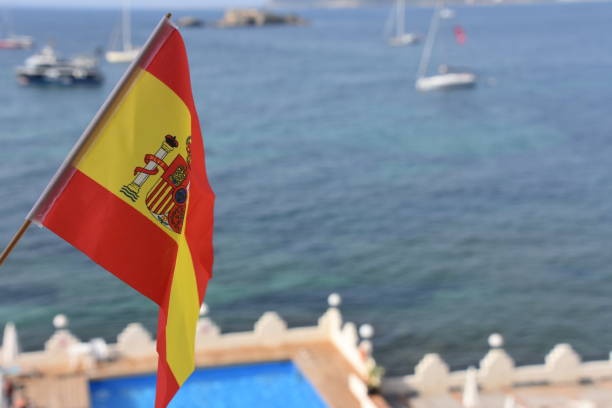 istock Flag of Spain at the Ibiza beach 820960572