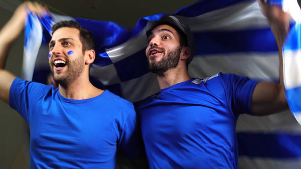 istock Greek Friends Waving Greece Flag 820965154