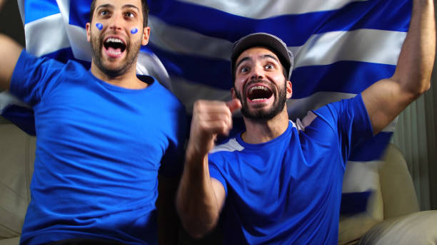 istock Greek Friends Waving Greece Flag 820965156