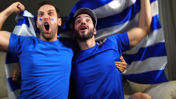 istock Greek Friends Waving Greece Flag 820965160