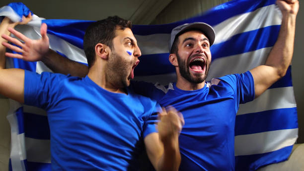 istock Greek Friends Waving Greece Flag 820965174