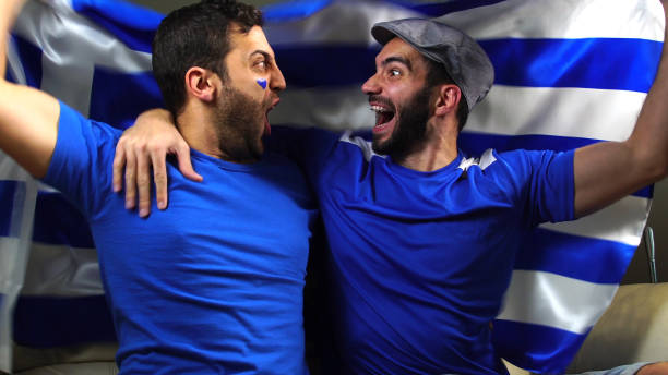 istock Greek Friends Waving Greece Flag 820965220