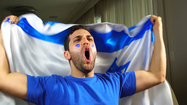 istock Israeli Guy Waving Israel Flag 820965300