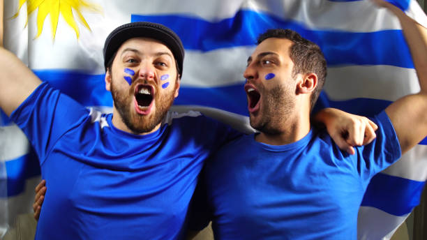 istock Uruguaian Friends Waving Uruguay Flag 820965368