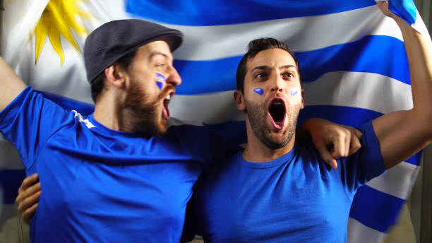 istock Uruguaian Friends Waving Uruguay Flag 820965378