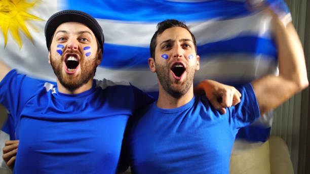 istock Uruguaian Friends Waving Uruguay Flag 820965410