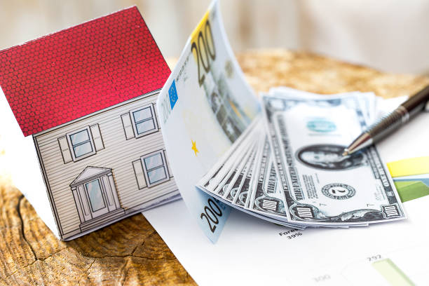 Mortgage, close up of home model, dollar money, investment, real estate and property concept stock photo