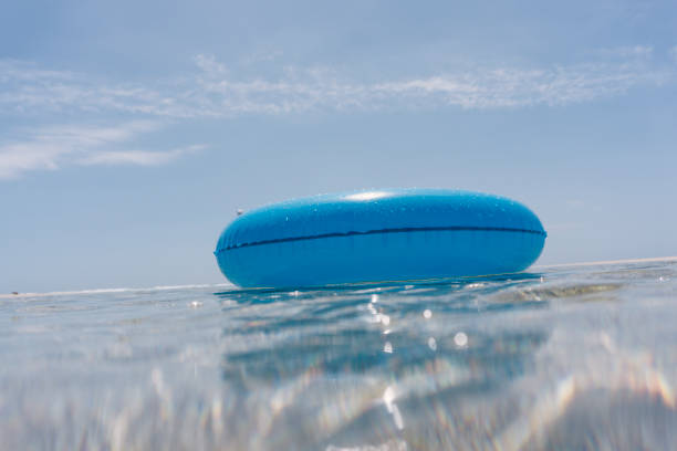 istock Blue rubber ring floating on the sea, Pedn Vounder Beach 820968694